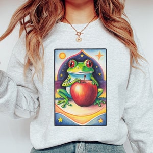 Sweat grenouille et pomme, cadeau pour diététiste, pull de diététiste pommes, santé et bien-être, carte de tarot art céleste, dessin au crayon