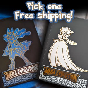 Peut inclure: Deux classeurs de cartes noirs et gris avec des motifs de personnages Pokémon. L'un présente un Lucario bleu et or, l'autre un Gardevoir blanc et or. Les deux ont le texte "MEGA EVOLUTION".