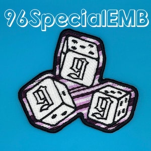 May include: Three purple and white striped dice with a white "9" on each face. The dice are embroidered and have a black outline. The image is labeled "96Special EMB".