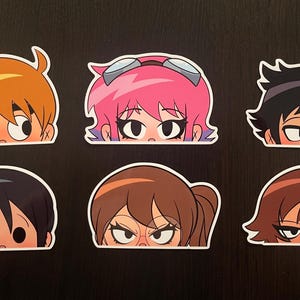 May include: Set of six cartoon character stickers featuring different characters with various hair colors and styles. Each sticker shows only the eyes and eyebrows of the character peeking over a surface.