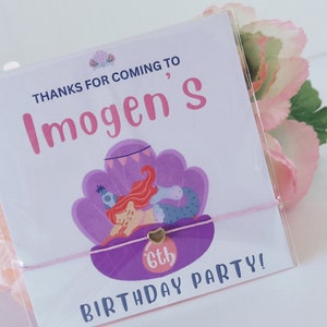 May include: A pink and purple thank you card with a mermaid illustration and the text "Thanks for coming to Imogen's 6th Birthday Party!"