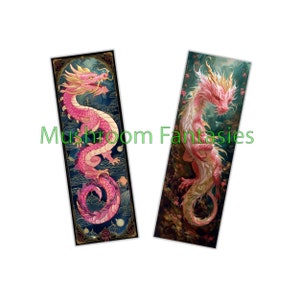 May include: Two pink dragon bookmarks with gold accents. The dragon on the left is curled up in a circle, while the dragon on the right is standing upright. Both dragons have detailed scales and intricate designs.