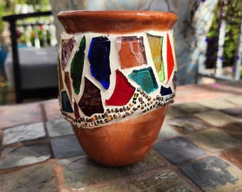 Decorated terracotta pot with mosaic, using colorful stained glass and glass seed beads.