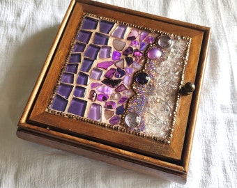 Handmade jewelry mosaic box, decorated on its lid with different purple shades and type of glass beads.