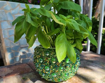 Beaded pot decorated by using a variety of green glass beads.