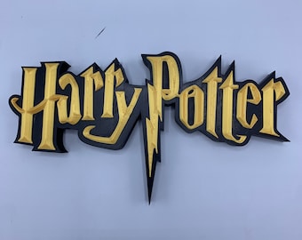May include: A 3D printed Harry Potter logo with a black outline and gold fill. The logo features the iconic lightning bolt.