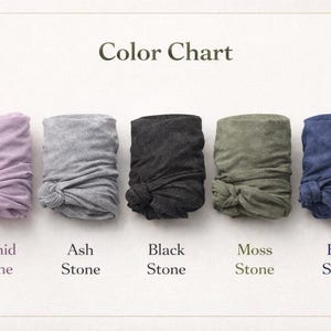 May include: Color chart displaying five folded fabric samples in various colors: orchid, ash, black, moss, and blue. Each sample is knotted at the bottom. The text "Color Chart" is at the top, with each color labeled below.