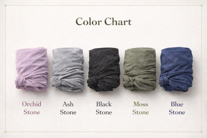 May include: Color chart displaying five folded fabric samples in various colors: orchid, ash, black, moss, and blue. Each sample is knotted at the bottom. The text "Color Chart" is at the top, with each color labeled below.