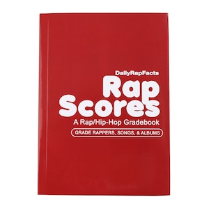 May include: A red book titled "Rap Scores" with white text. The book is a Rap/Hip-Hop Gradebook, designed to grade rappers, songs, and albums. The brand name "DailyRapFacts" is at the top.