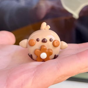 Desk buddy decor, cute polymer clay friend with orange flower, office companion/study buddy, small handmade bird figurine