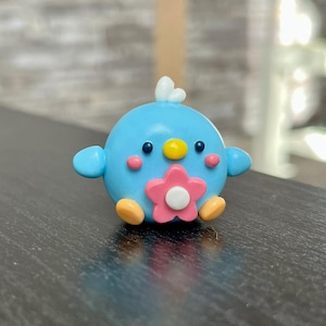Desk buddy decor, cute polymer clay friend with pink flower, office companion/study buddy, small handmade bird figurine