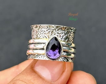 Amethyst Spinner Ring - Ruhige Eleganz und Beruhigende Bewegung