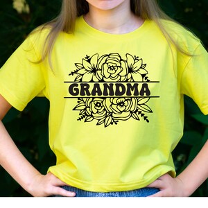 May include: A yellow t-shirt with a black floral design and the word "GRANDMA" in a retro font.