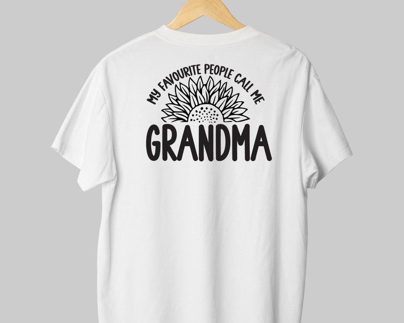 May include: White t-shirt with a black sunflower graphic and the text "My favorite people call me Grandma".