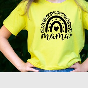 May include: A yellow t-shirt with a black and white leopard print rainbow design and the word "mama" underneath.