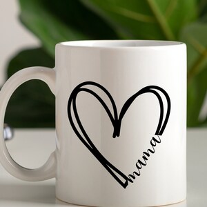 May include: White ceramic mug with a black hand-drawn heart design and the word "mama" inside the heart.