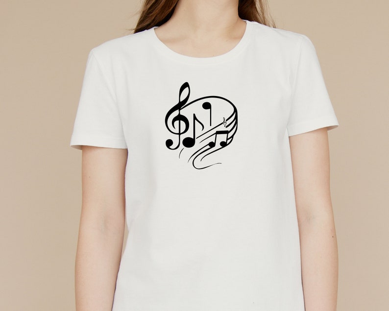 May include: White t-shirt with a black musical note design. The design features a treble clef and musical notes.