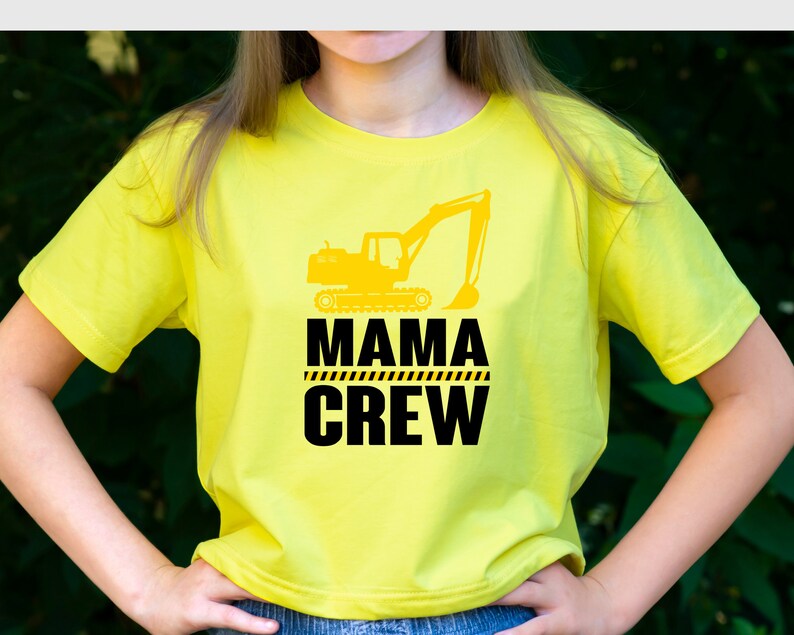 May include: Yellow t-shirt with a black graphic of an excavator and the text "Mama Crew".