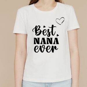 May include: White t-shirt with black text that reads "Best Nana Ever" and a small heart with the word "Nana" inside.