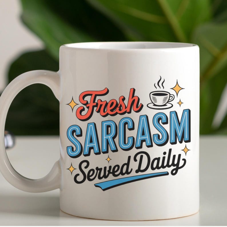May include: White ceramic mug with the text "Fresh Sarcasm Served Daily" in red, blue, and black lettering. The mug also features a small coffee cup graphic with steam and star accents. The mug has a curved handle.