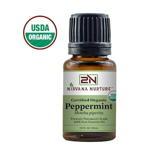 May include: A brown glass bottle with a black cap containing Certified Organic Peppermint essential oil. The bottle is labeled with the brand name "Nirvana Nurture" and the USDA Organic seal. The bottle contains 1/3 fluid ounce (10mL) of oil.