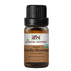 May include: A small glass bottle of Nirvana Nurture organic vanilla oleoresin. The bottle has a black cap and a brown label with the text "Vanilla Oleoresin" and "100% Pure Premium Grade". The bottle contains 1/3 fl oz (10mL).