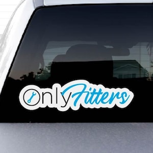 May include: A white sticker with the text "Only Fitters" in a stylized blue font, with a wrench icon. The sticker is affixed to the rear window of a silver vehicle.