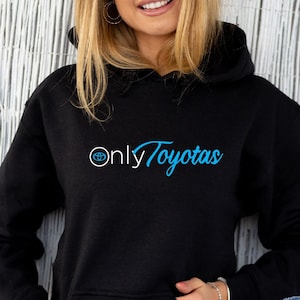 May include: Black hoodie with a blue and white logo that says "Only Toyotas".