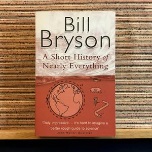 A Short History of Nearly Everything by Bill Bryson - Vintage Illustrated 1st Paperback Edition Science Book, Black Swan 2004, 23rd Printing