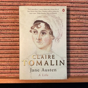 May include: A book cover with a portrait of Jane Austen, the author of "Pride and Prejudice". The title of the book is "Claire Tomalin Jane Austen A Life".