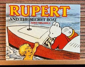 Rupert and the Secret Boat de Mike Trumble, d'après une histoire d'Alfred Bestall MBE - première édition reliée, Guild Publishing, 1989