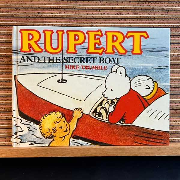 Rupert and the Secret Boat de Mike Trumble, d'après une histoire d'Alfred Bestall MBE - première édition reliée, Guild Publishing, 1989