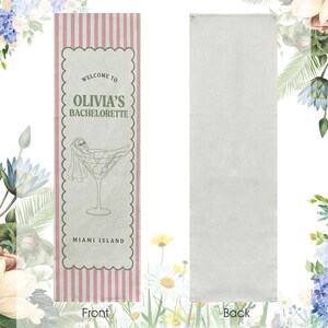 May include: A rectangular banner with a pink and white striped border and a scalloped edge. The front features text that reads "WELCOME TO OLIVIA'S BACHELORETTE MIAMI ISLAND" and a graphic of a woman in a martini glass. The back is plain.
