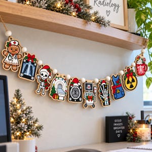 May include: A wooden garland featuring medical-themed Christmas ornaments including a gingerbread nurse, an X-ray, a skeleton in a Santa hat, an MRI machine, a brain scan, an ultrasound, a skeletal hand, a lead apron, and a radiation symbol.