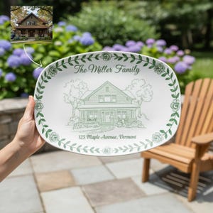 May include: White oval serving platter with a green floral border and a detailed sketch of a house. The text "The Miller Family" and "125 Maple Avenue, Vermont" are printed on the platter.