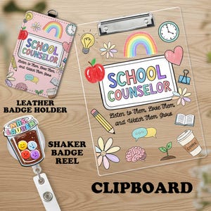 May include: A pink leather badge holder, a clear clipboard, and a shaker badge reel. The badge holder and clipboard feature the text "SCHOOL COUNSELOR" with colorful illustrations of an apple, rainbow, and pencil. The shaker badge reel has a coffee cup design.