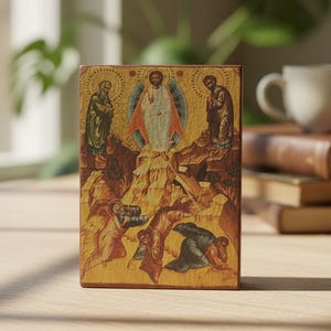 May include: A rectangular wooden icon depicting the Transfiguration of Christ. The central figure is surrounded by a blue mandorla, flanked by two figures on rocky peaks, with three figures in robes kneeling and falling below on the ground.