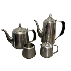 May include: A set of four silver tea and coffee pots. The set includes two teapots, a creamer, and a sugar bowl.