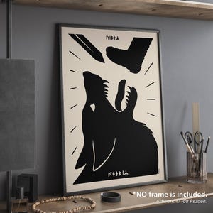 May include: Framed art print with a black wolf howling design. The artwork features a black pencil and foot above the wolf, set against an off-white background. Includes text. Artwork by Ida Rezaee.