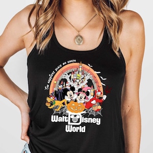 May include: Black tank top featuring a colorful Halloween-themed graphic with Disney characters, a castle, and the text "Walt Disney World". The design includes a rainbow, bats, and a jack-o'-lantern.