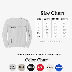 May include: Size chart for a heavy blended crewneck sweatshirt with measurements in inches. The chart shows sizes S, M, L, XL, and 2XL with corresponding width, length, and sleeve measurements. The sweatshirt is available in colors: Sport Gray, Sand, Black, Red, White, and Royal.