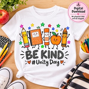 May include: A white t-shirt featuring a colourful graphic of a smiling pencil, notebook, glue stick, apple, and crayon. The text reads BE KIND #Unity Day. The design includes small multi-coloured stars and hearts surrounding the characters.