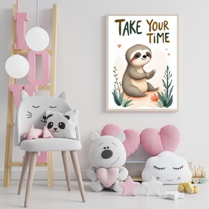 May include: A framed print featuring a cartoon sloth with the text "Take Your Time". The sloth is gray and tan, sitting among green plants and a small orange flower. The room also includes a white chair, pillows, and decorative toys.