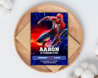 May include: A blue and red birthday invitation featuring a superhero character, Spiderman, in a dynamic pose. The invitation reads "Aaron is turning five!" with the date and time of the party.