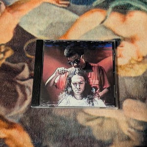 Bones & Curtis Heron PermanentFrown CD