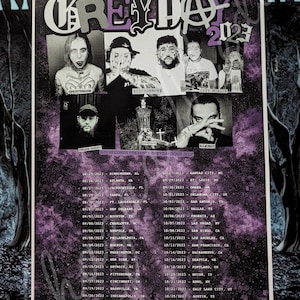 May include: A concert poster for the Greyday 2023 tour, featuring black and white photos of the performing artists. The poster has a purple and black color scheme and lists tour dates across the United States.