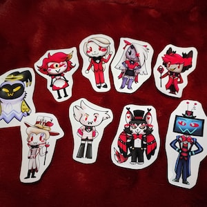 Stickers Hazbin Hotel Chibi - Adam, Nifty, Charlie, Vaggie, Alastor, Lucifer, Angeldust, Husk et Vox