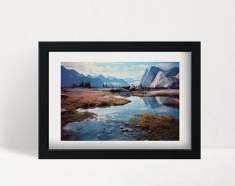 May include: A framed photograph of a mountain lake reflecting the surrounding mountains and sky. The water is a deep blue, and the mountains are a mix of blue, green, and white. The sky is a light blue with some clouds.