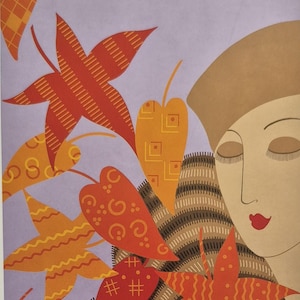 May include: An art deco style illustration featuring a woman with closed eyes, wearing a brown hat and a patterned scarf. The artwork includes stylized orange and red leaves against a lavender background.