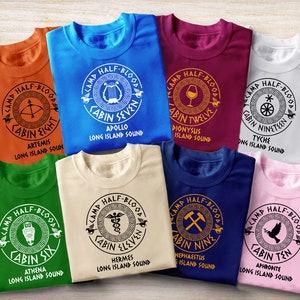 Camp Half Blood Shirts with Cabin Logo / Percy Jackson sold by DaviHoffman, SKU 24913823